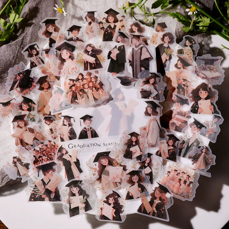 Graduates caps diplomas and floral journaling stickers