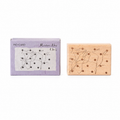 Chaotic coils wooden rubber stamp with retail box on white background