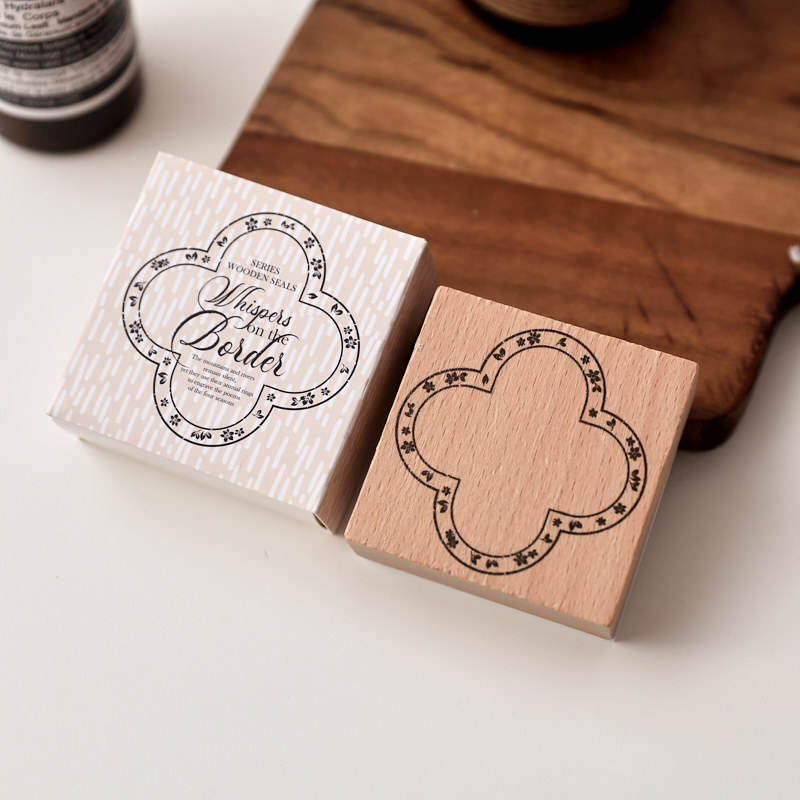 Floral Quatrefoil Frame Wooden Stamp with packaging in the original photograph